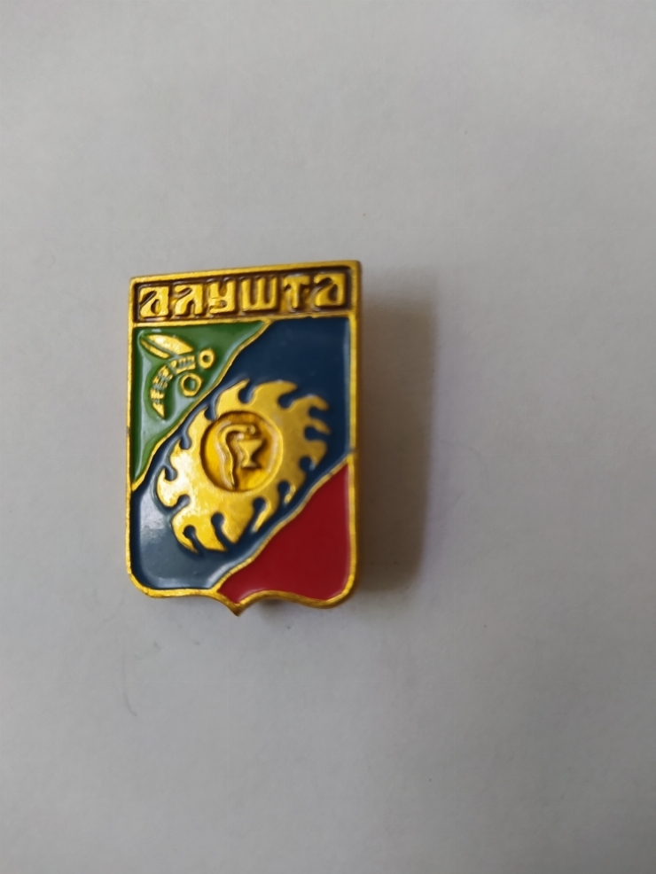 значок
