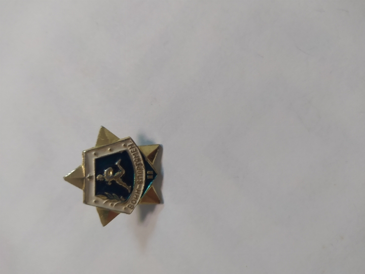 значок
